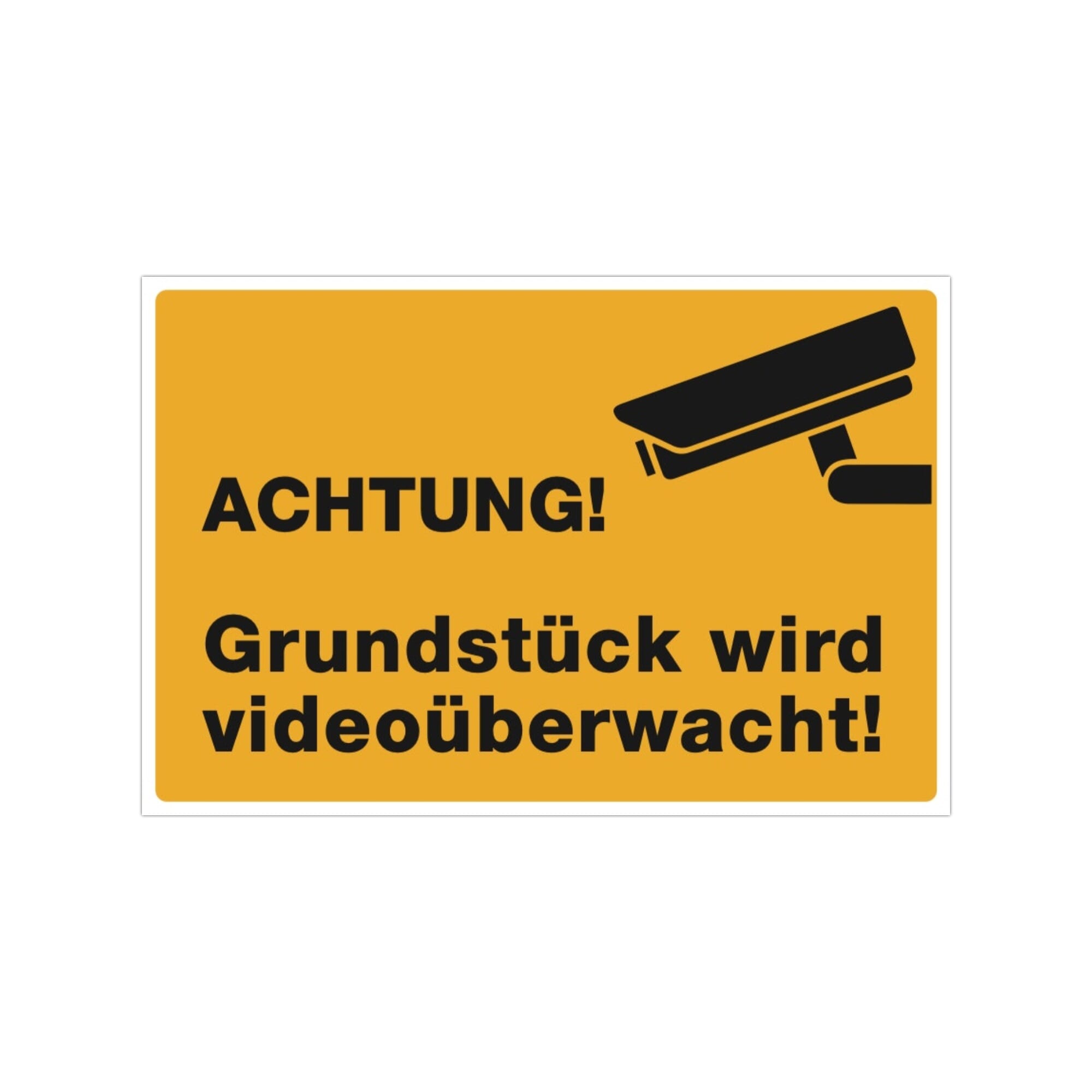 Drei gelbe Aufkleber mit "Achtung! Grundstück wird videoüberwacht!", 300x200 mm, auf einer Oberfläche sichtbar